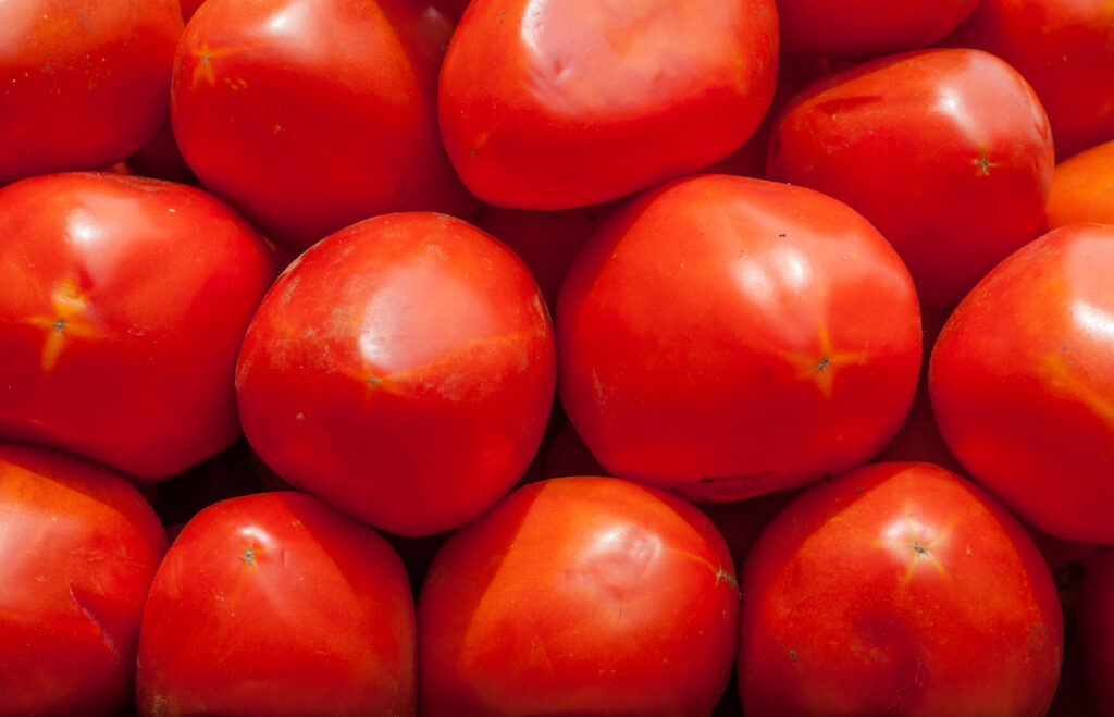 A photo of tomatoes stacked on each other