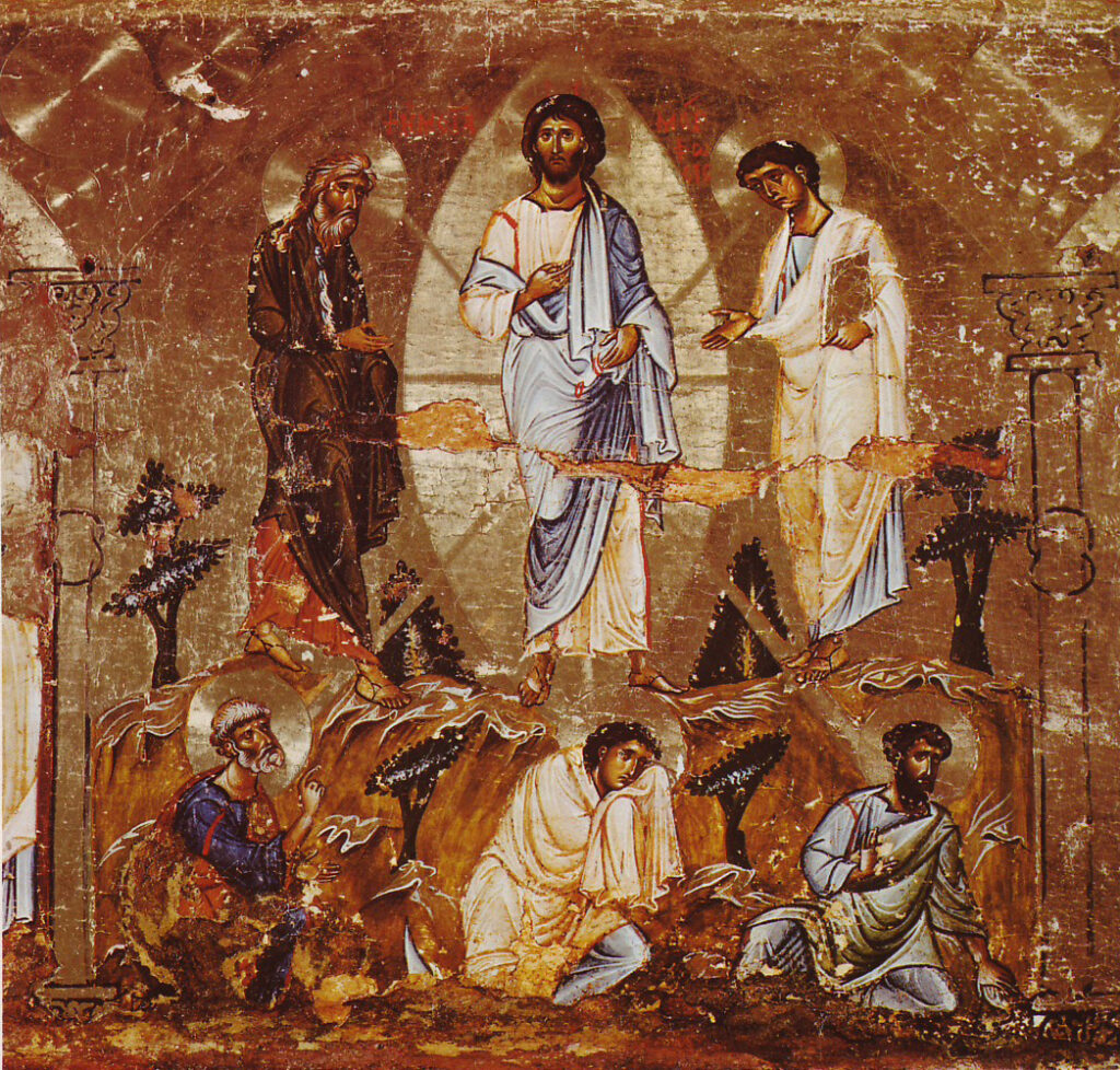 A photo of an icon of the transfiguration of Christ in Saint Catherine's Monastery, Sinai (Egypt). Jesus, robed in white and blue, stands between Moses & Elijah while Peter, James, and John  sit stunned at the ground beneath them.