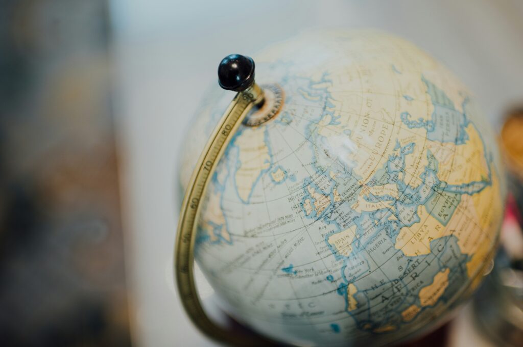 A photo of a desktop globe, with the background blurred out